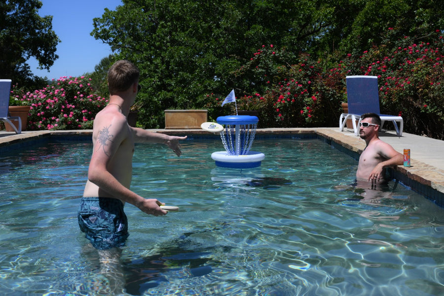 Player throwing a floating disc toward the PuddlePutt basket